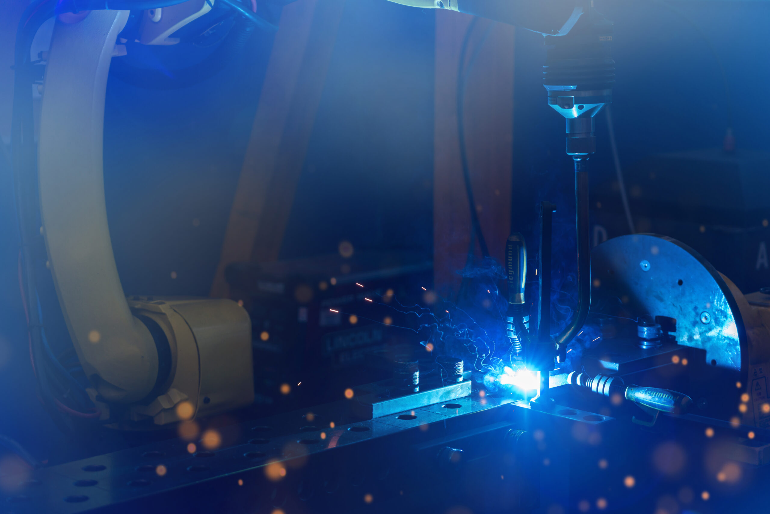 Welding in progress, sparking seam