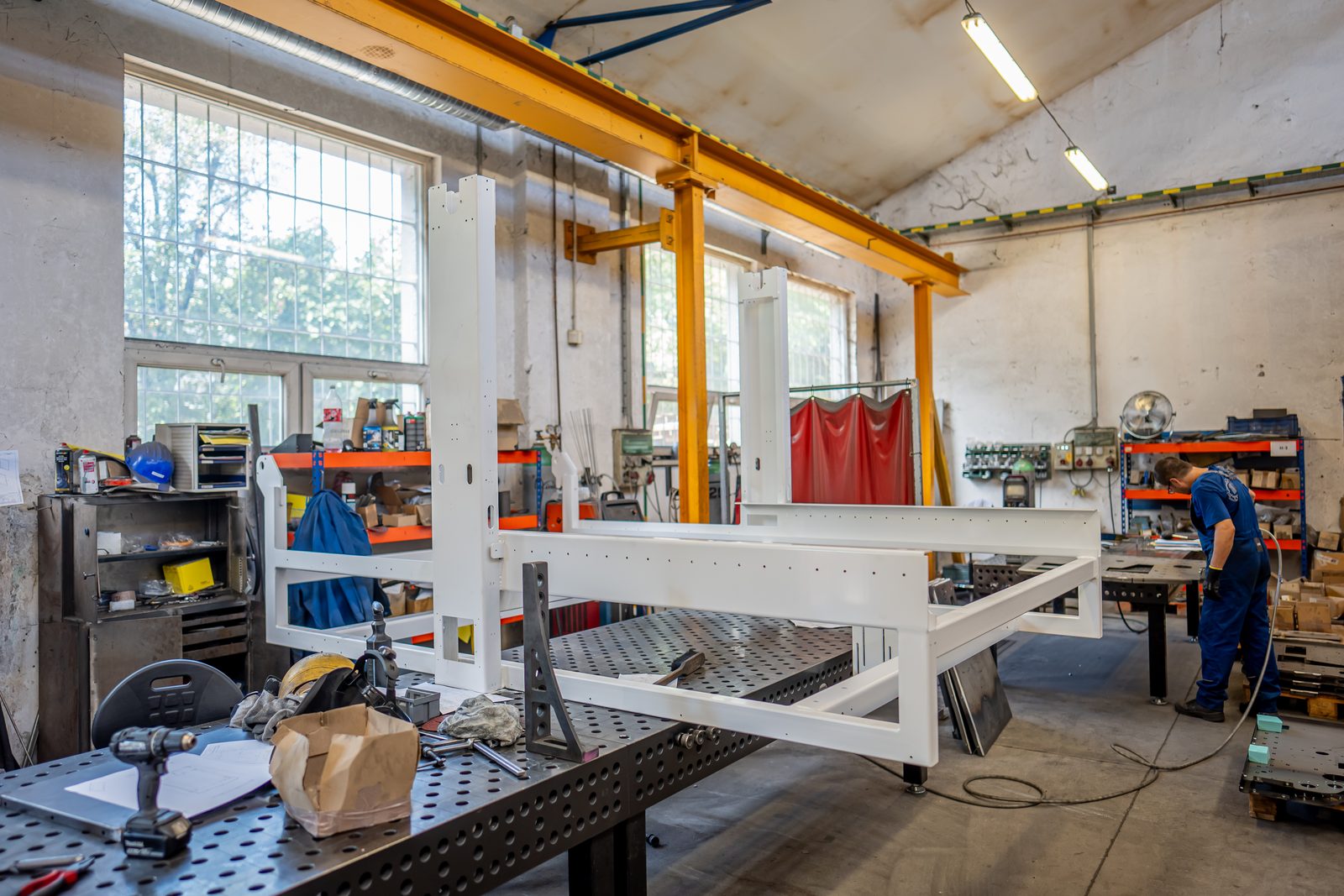 Powder-coated welded white steel frame in the workshop